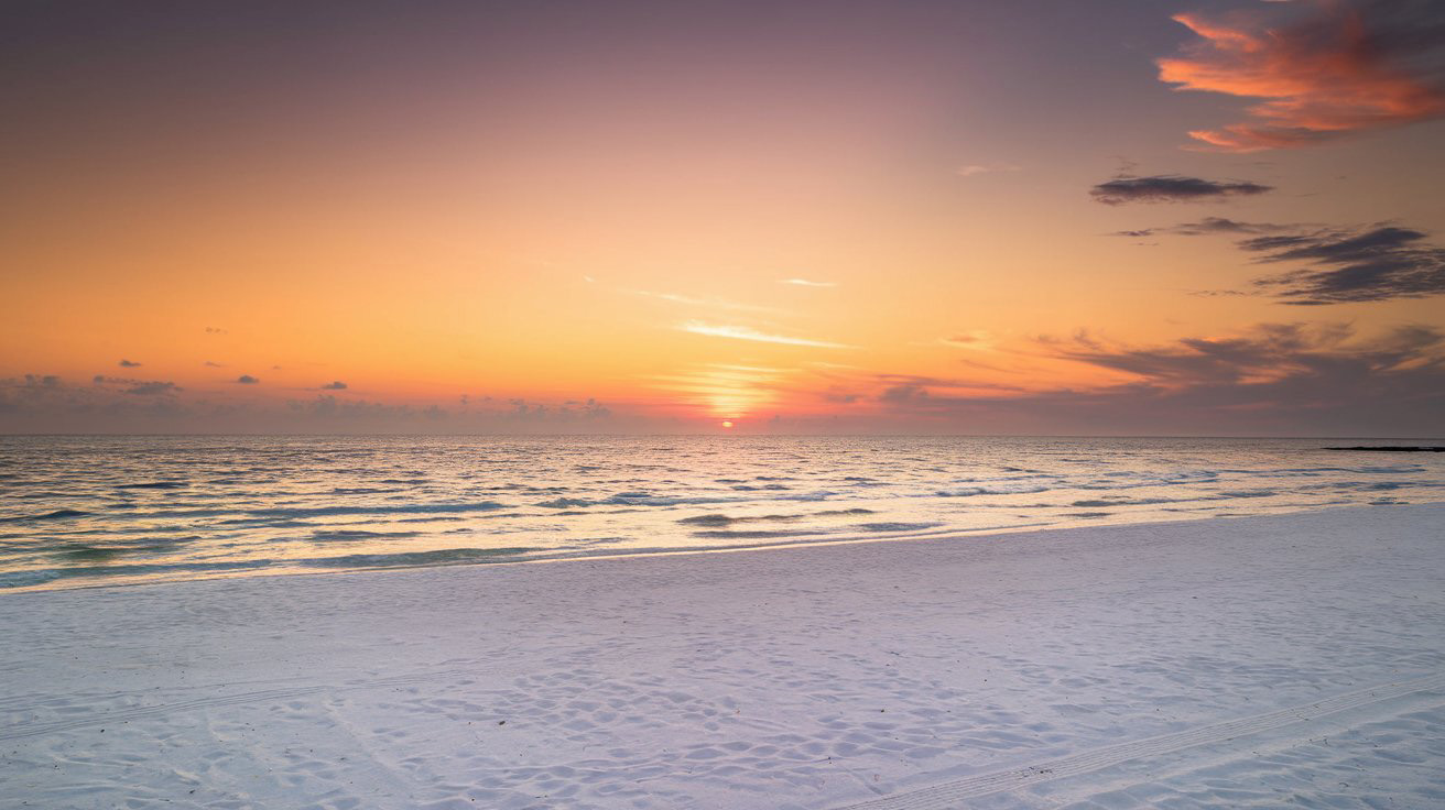 Voyage de noces 2025 / 2026 sur une plage paradisiaque au coucher du soleil.